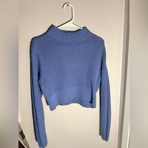 La Hearts cropped turtleneck sweater.